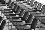 Line of chairs set up for a public meeting