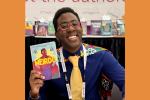 Tony Weaver Jr. with a copy of his book Weirdo.